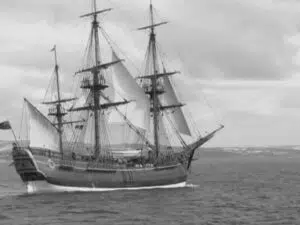 Tall ship with sails at sea