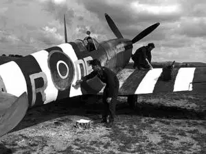 Painting invasion stripes on a WWII spitfire