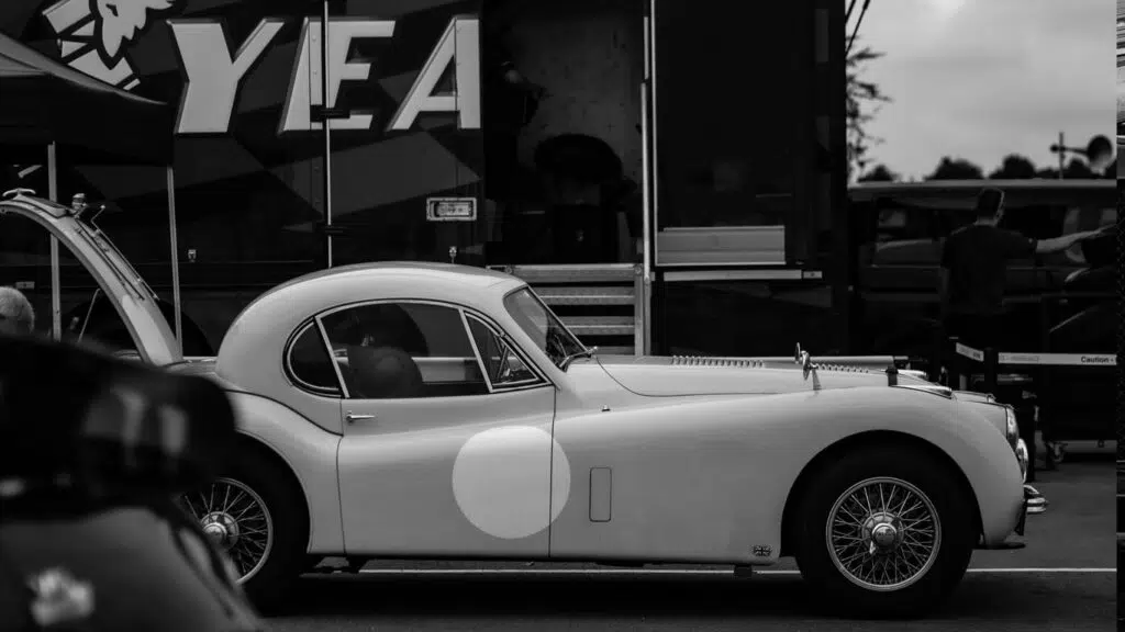 Black and white picture of parked car side profile