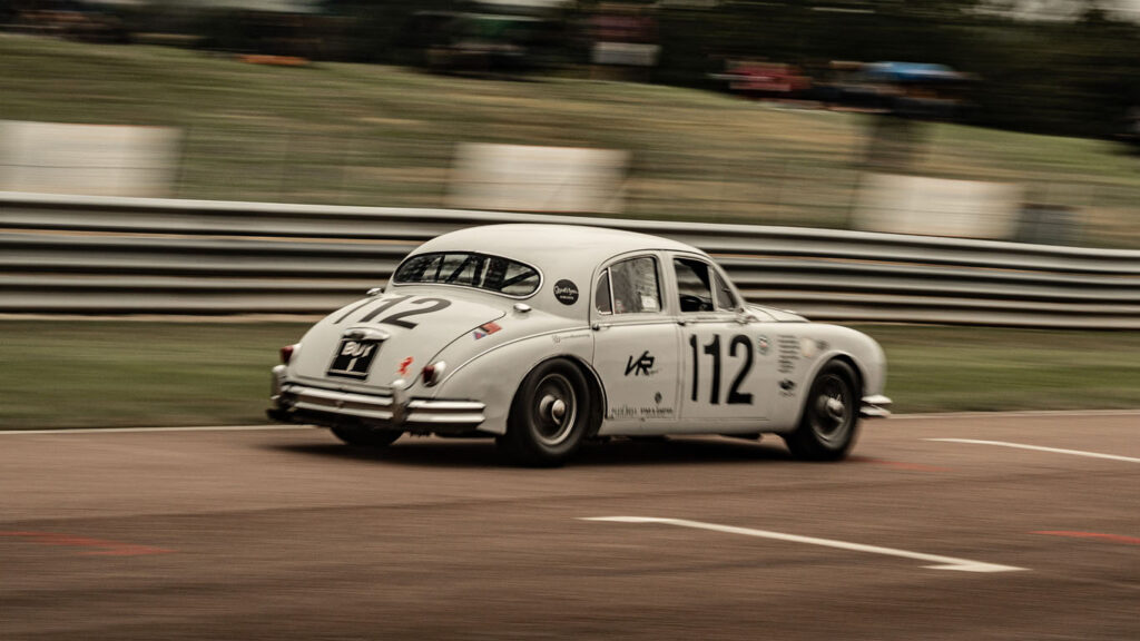 Vintage jaguar car racing on track