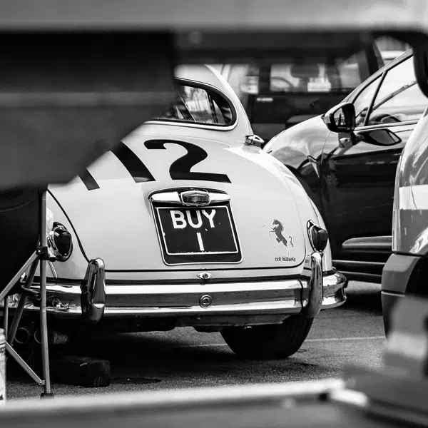 Black and white photo of rear of jaguar car