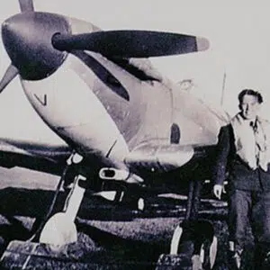 Spitfire with pilot standing beside