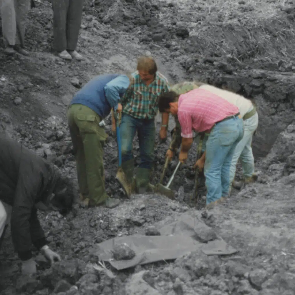 Men digging in a hole