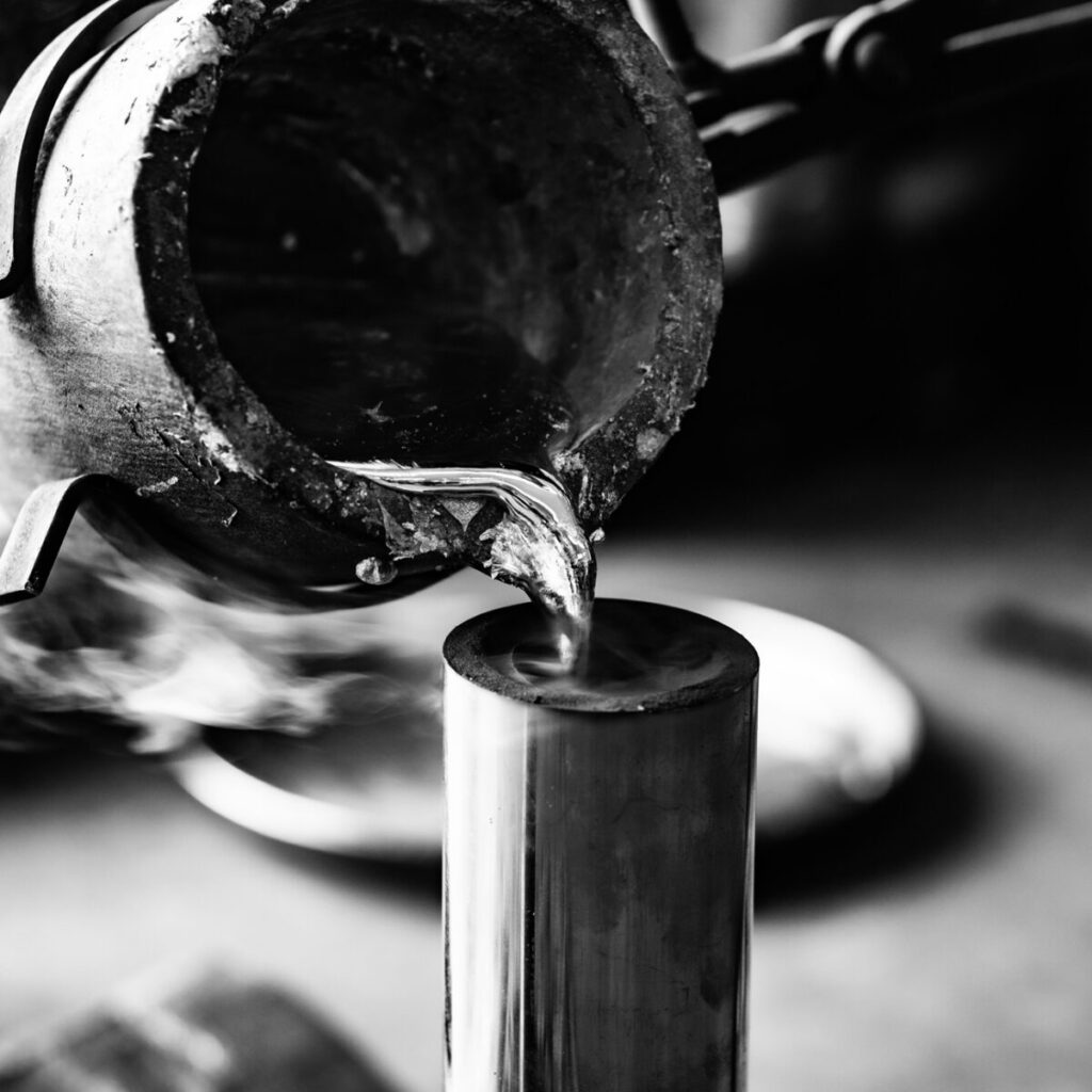 Liquid metal being poured into a tube