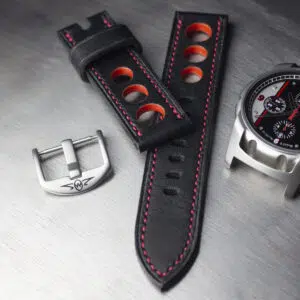 Black leather strap with red stitching and red painted through rally holes separate buckle and zero west CR-2 watch