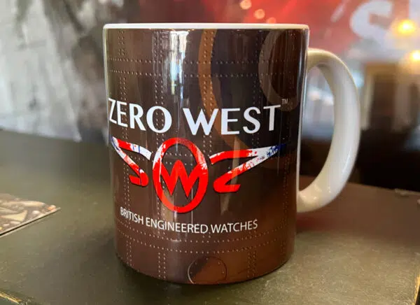 Zero West printed mug on top of a wooden box with logo