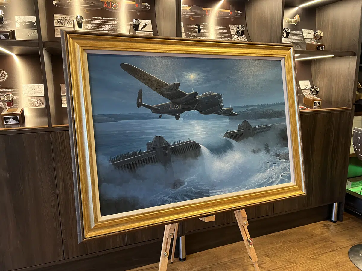 Photo of Lancaster bomber painting in gold frame