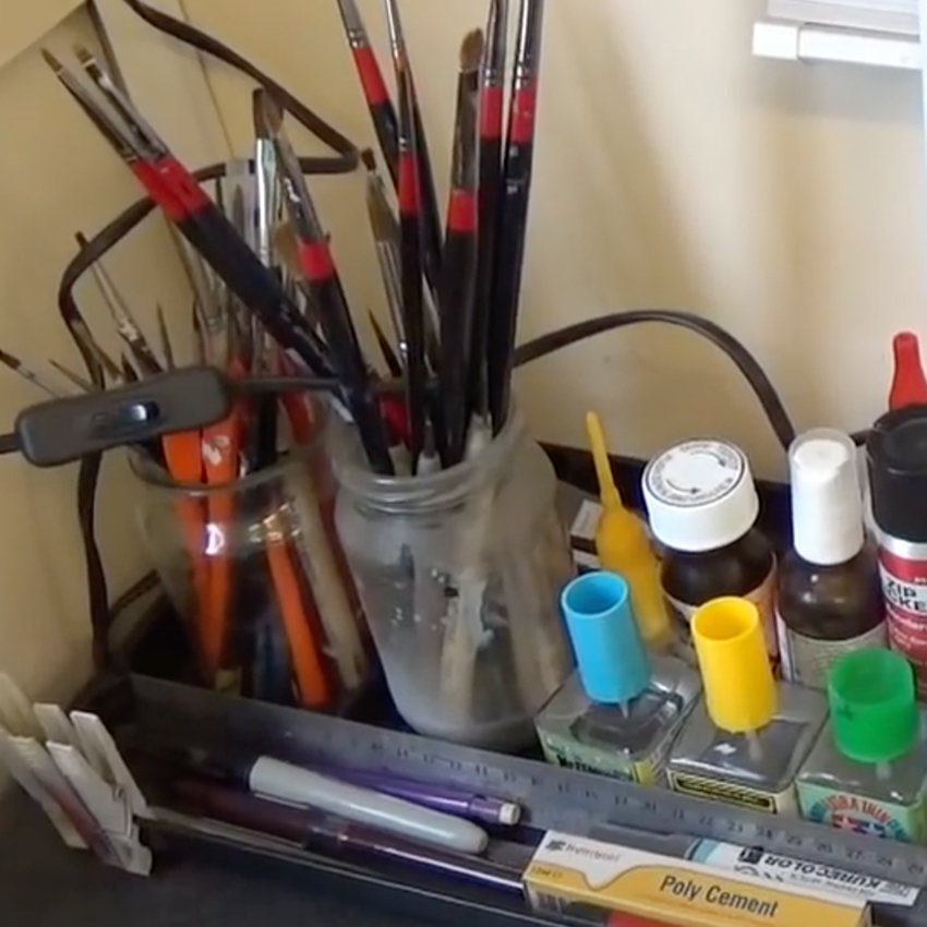 Artist paints and brushes