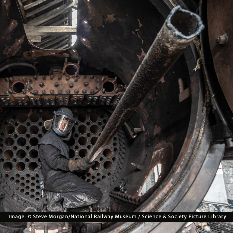 Flying Scotsman boiler tube being removed from engine