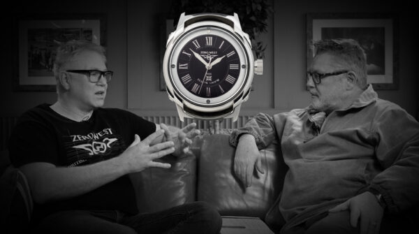 Two men discussing a watch.